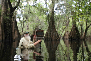 Renowned photographer Clyde Butcher working in the swamps of Florida. Photo: Niki Butcher
